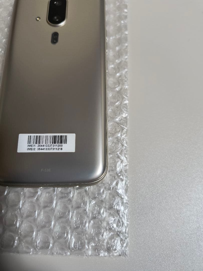 らくらくスマートフォン F-53E ゴールド 新品ケース、フィルム付き
